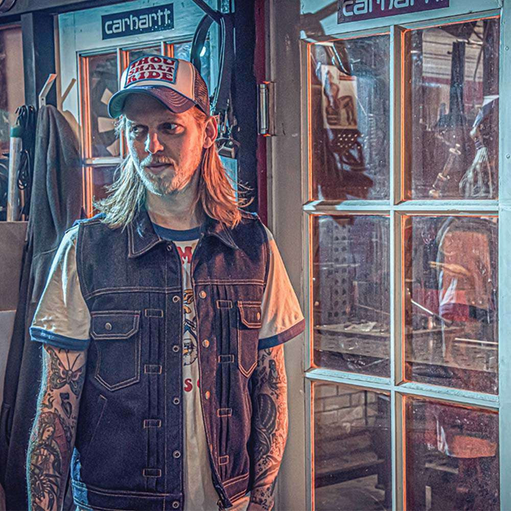 man wearing Denim vest