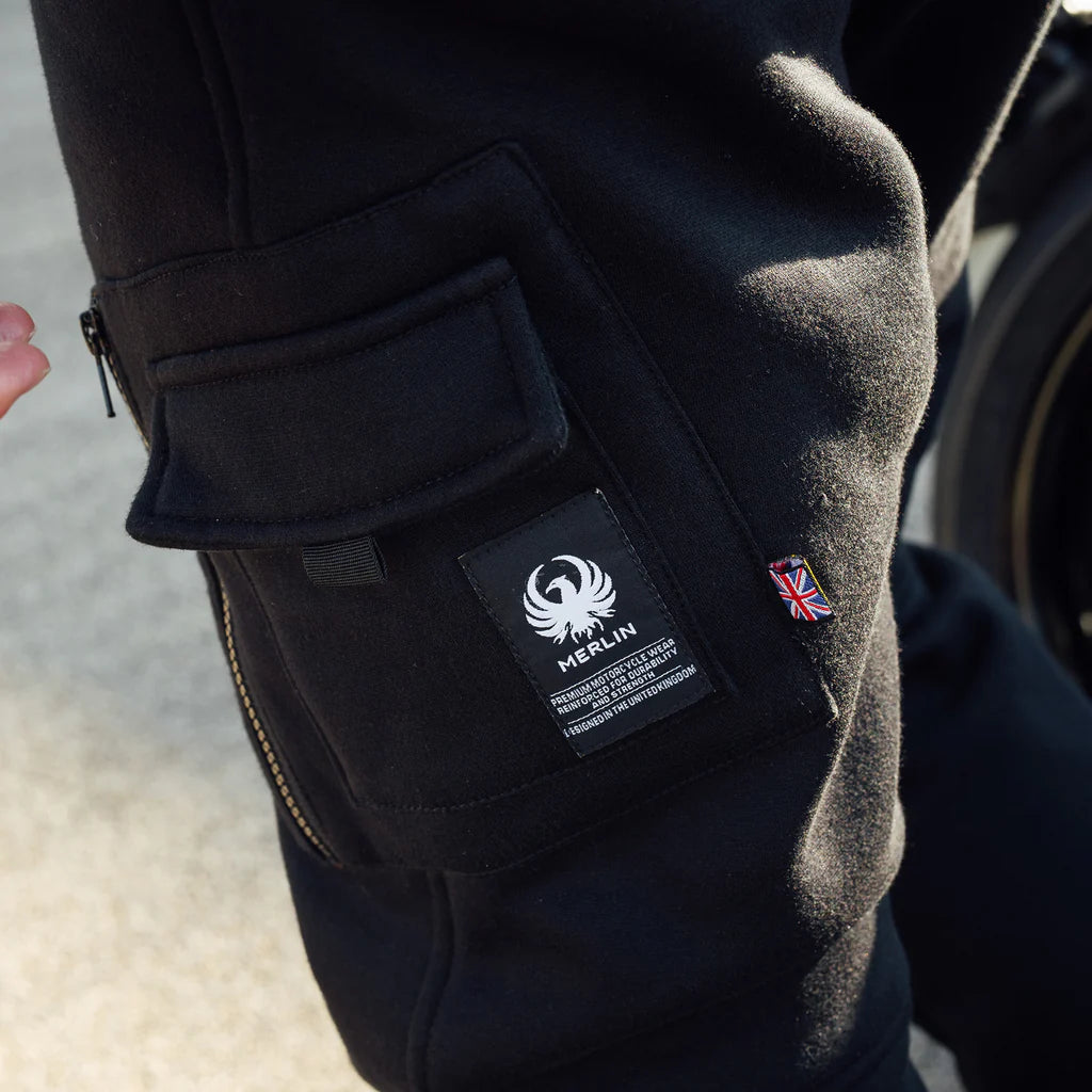 Close-up of the Merlin branding on the Merlin repton jogging bottoms featuring a Union Jack patch and side pocket. protective motorcycle jogging bottoms.